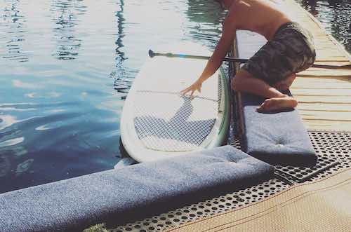 how to get on a paddle board on the dock